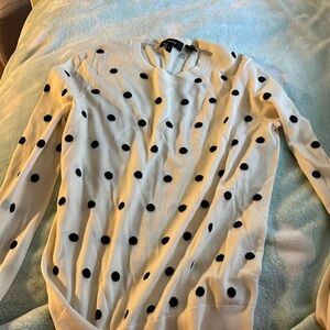 White sweater with black pocsdots